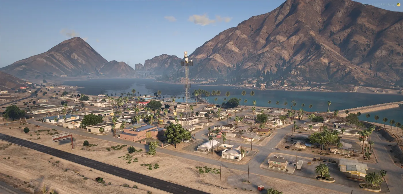 Sandy Shores seen from the highway, the rebuilt town and motel below with the Alamo Sea behind